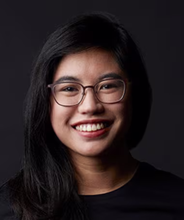 A smiling accessibility expert, representing an Ally team member.